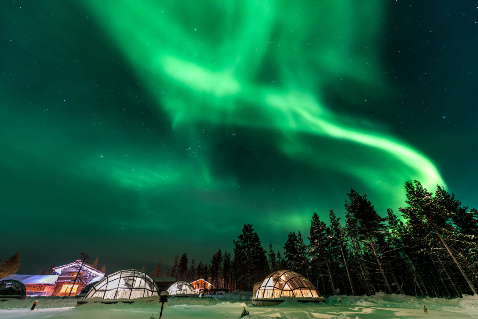 Northern Lights over Glass Igloo Hotel in Lapland.